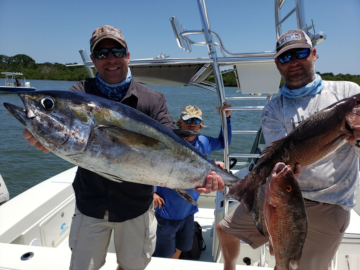 Catching tuna and snapper, Deep sea fishing with clients in New Smyrna Beach, Florida