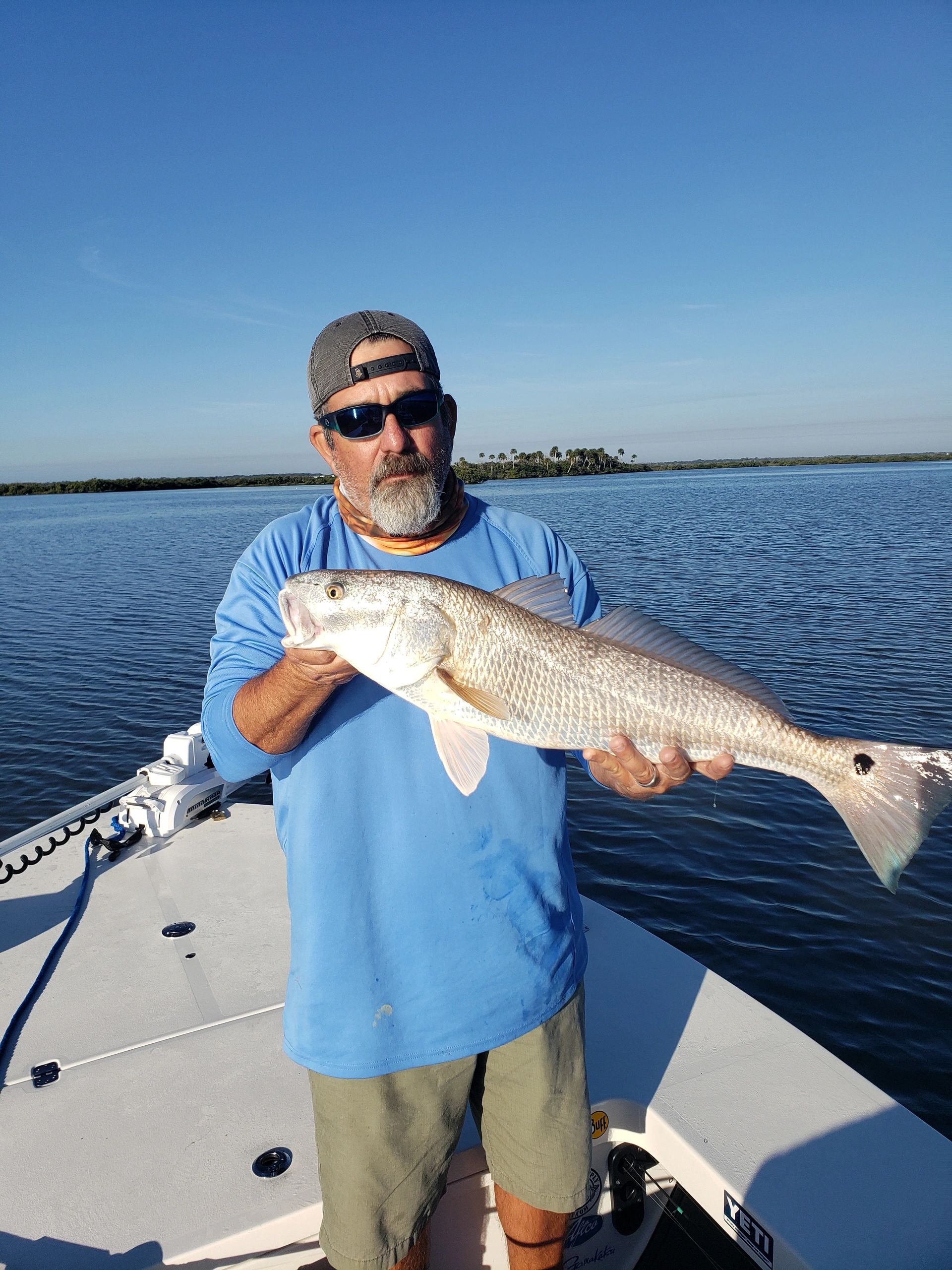 Client with a redfish during a December inshore fishing trip