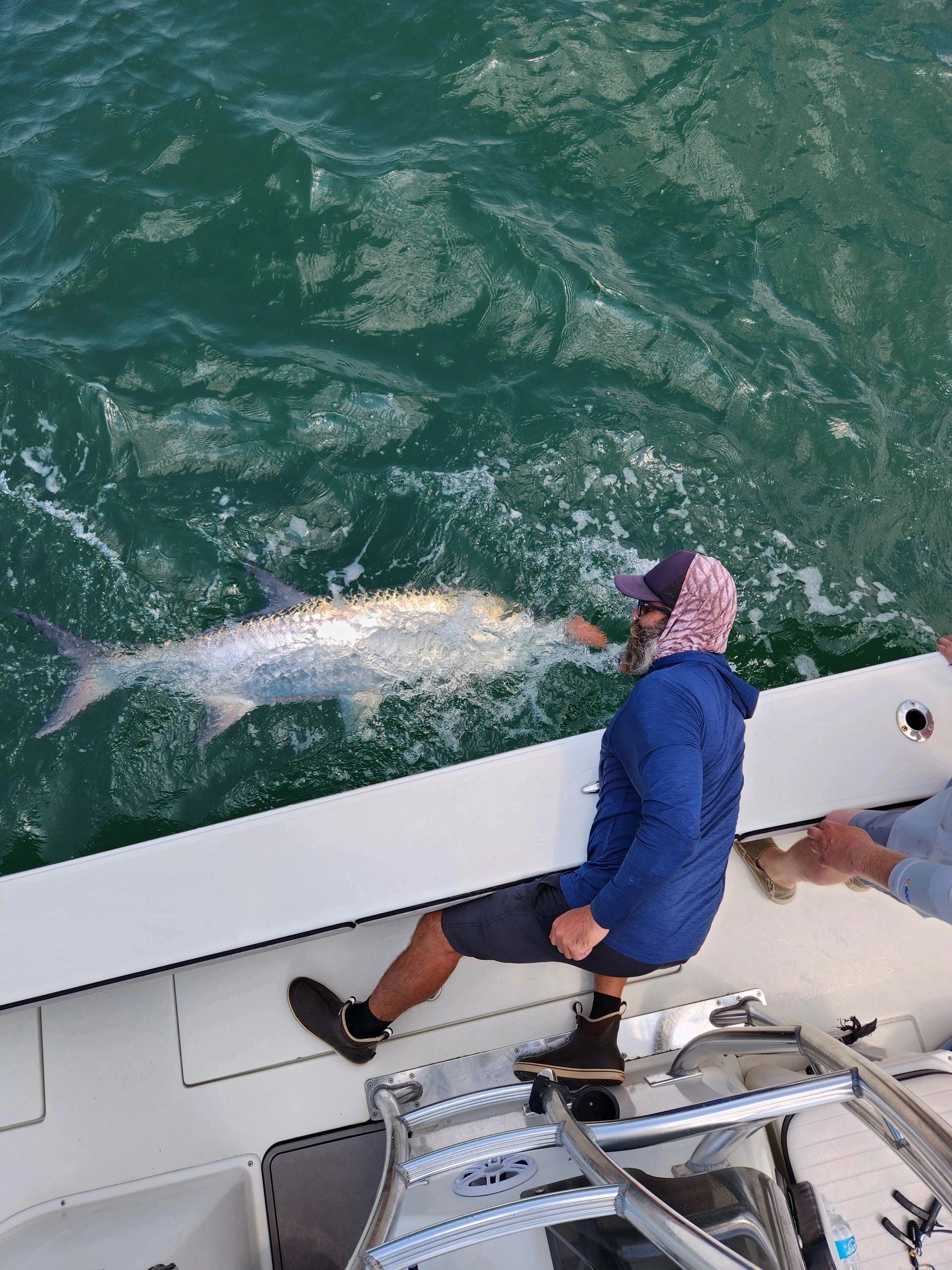 Client with tarpon caught on a fishing charter